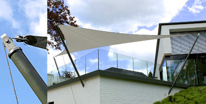 Textiles Bauen - Sonnensegel auf einer Terrasse an zwei Masten mit Seilen abgespannt